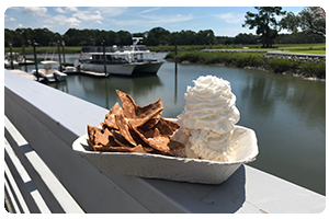 Homemade
Salty Dog ice cream topped with fresh whipped cream served
with a side of waffle cone ‘chips.’
